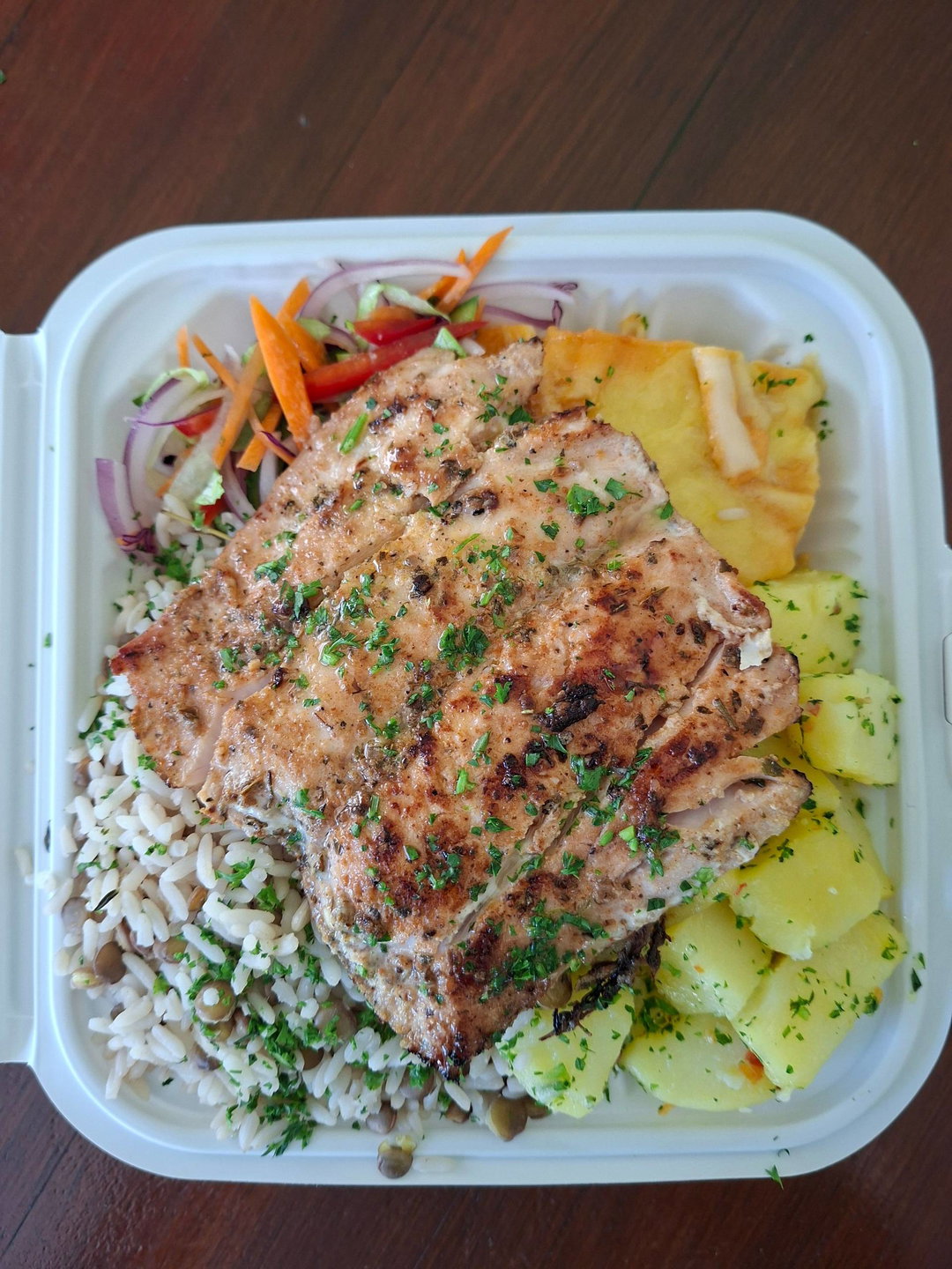 Tarragon potatoes, macaroni pie, rice and peas, dolphin (mahi mahi), chef's salad.