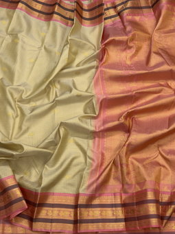 Beige Kanchipuram with peach pink pallu