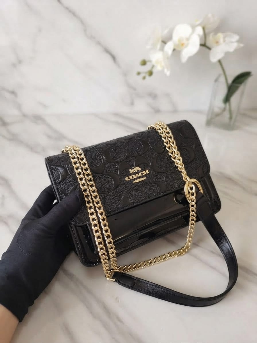 Coach black chained