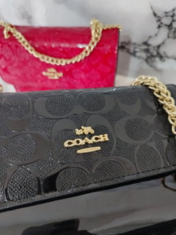 Coach black chained 