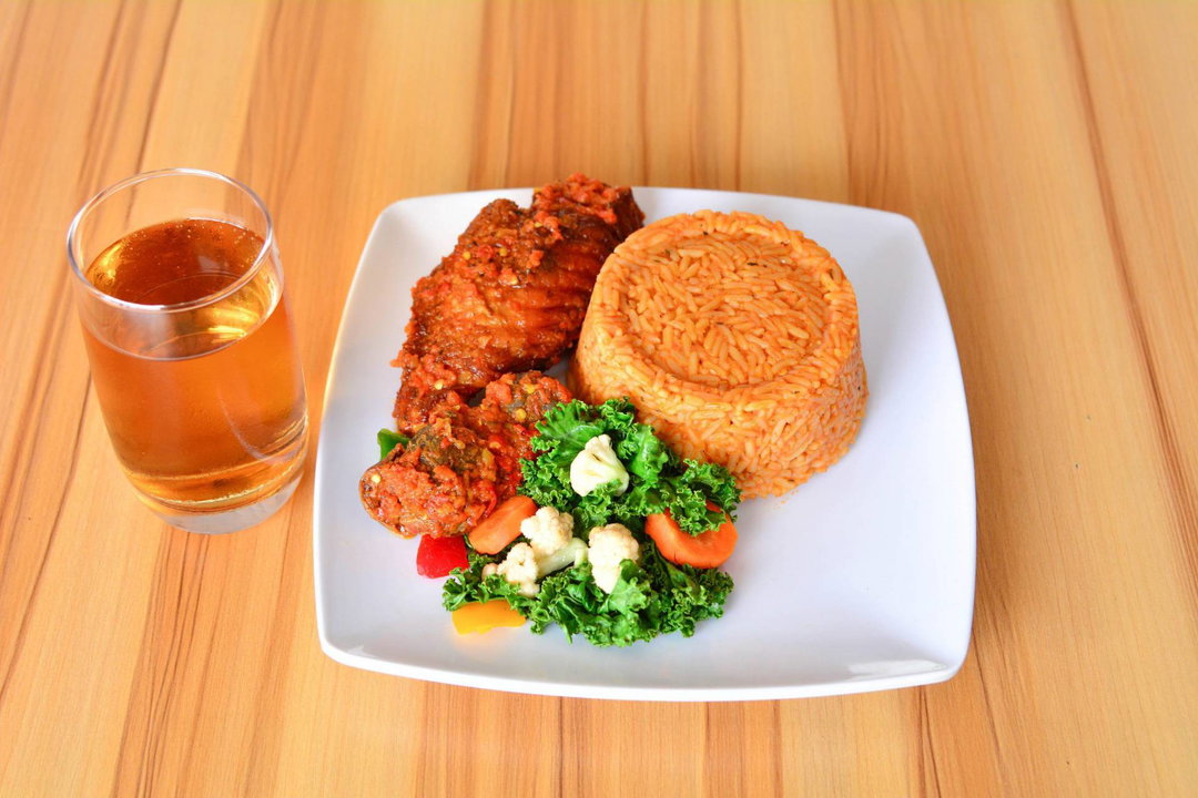 Jollof Rice & Medium size Chicken served with Salad
