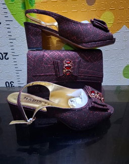 2-piece set featuring mid-heel slingback sandals and a structured clutch purse,