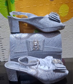 2-piece set featuring mid-heel slingback sandals and a structured clutch purse,