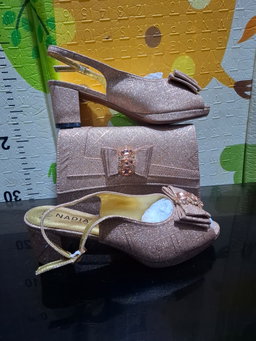 2-piece set featuring mid-heel slingback sandals and a structured clutch purse,