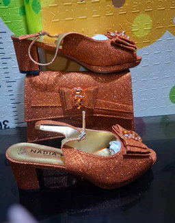 2-piece set featuring mid-heel slingback sandals and a structured clutch purse,
