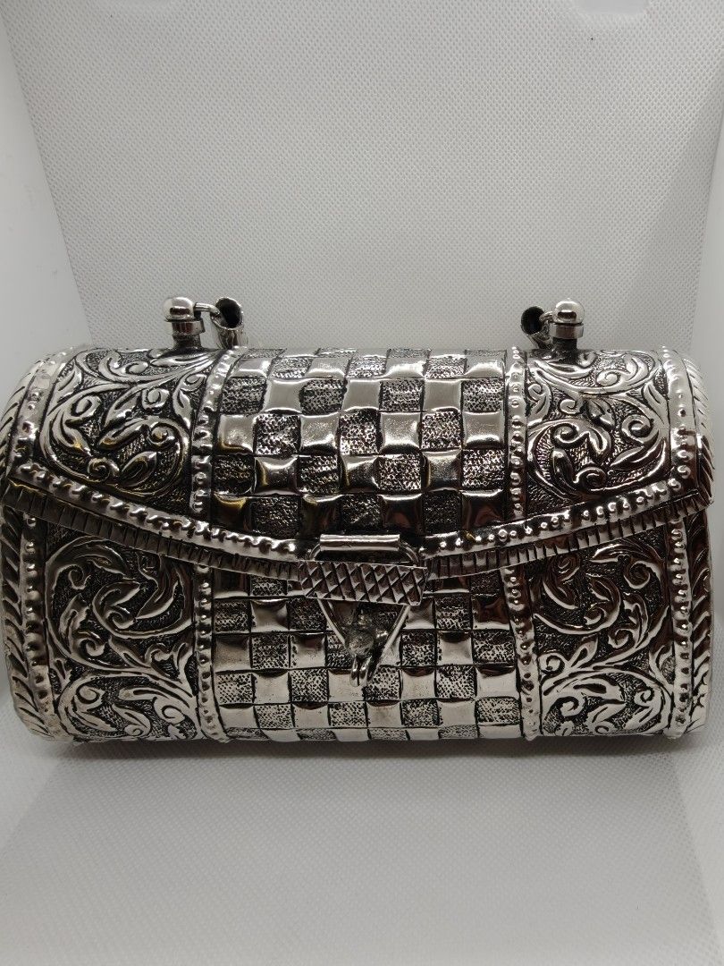 Carved oxidized bag with handle
